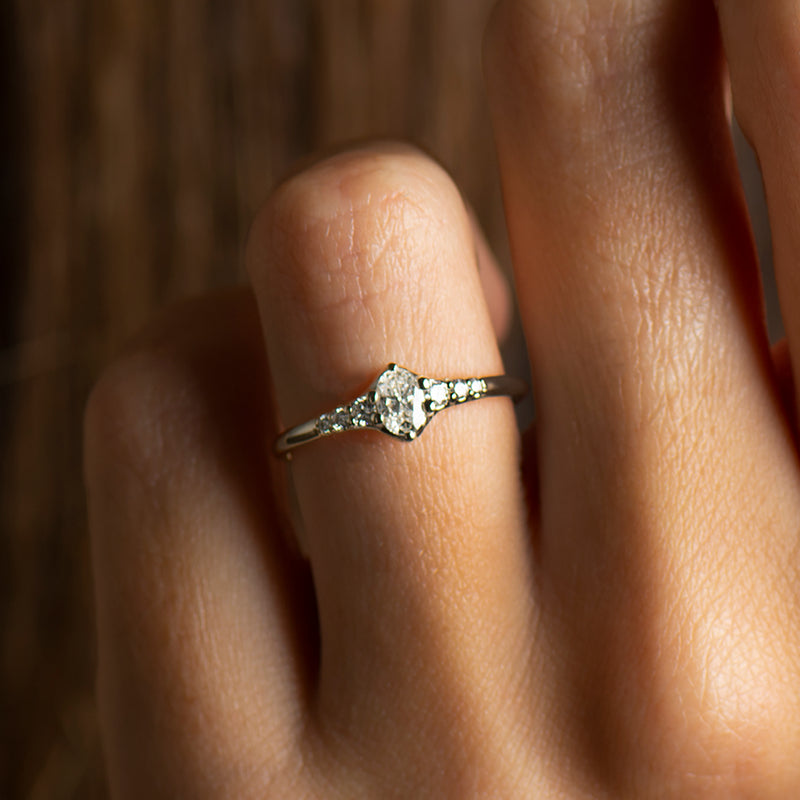 Tapered tiny oval diamond ring
